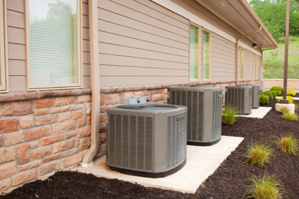 Multiple Air Conditioner Units Outside A Home